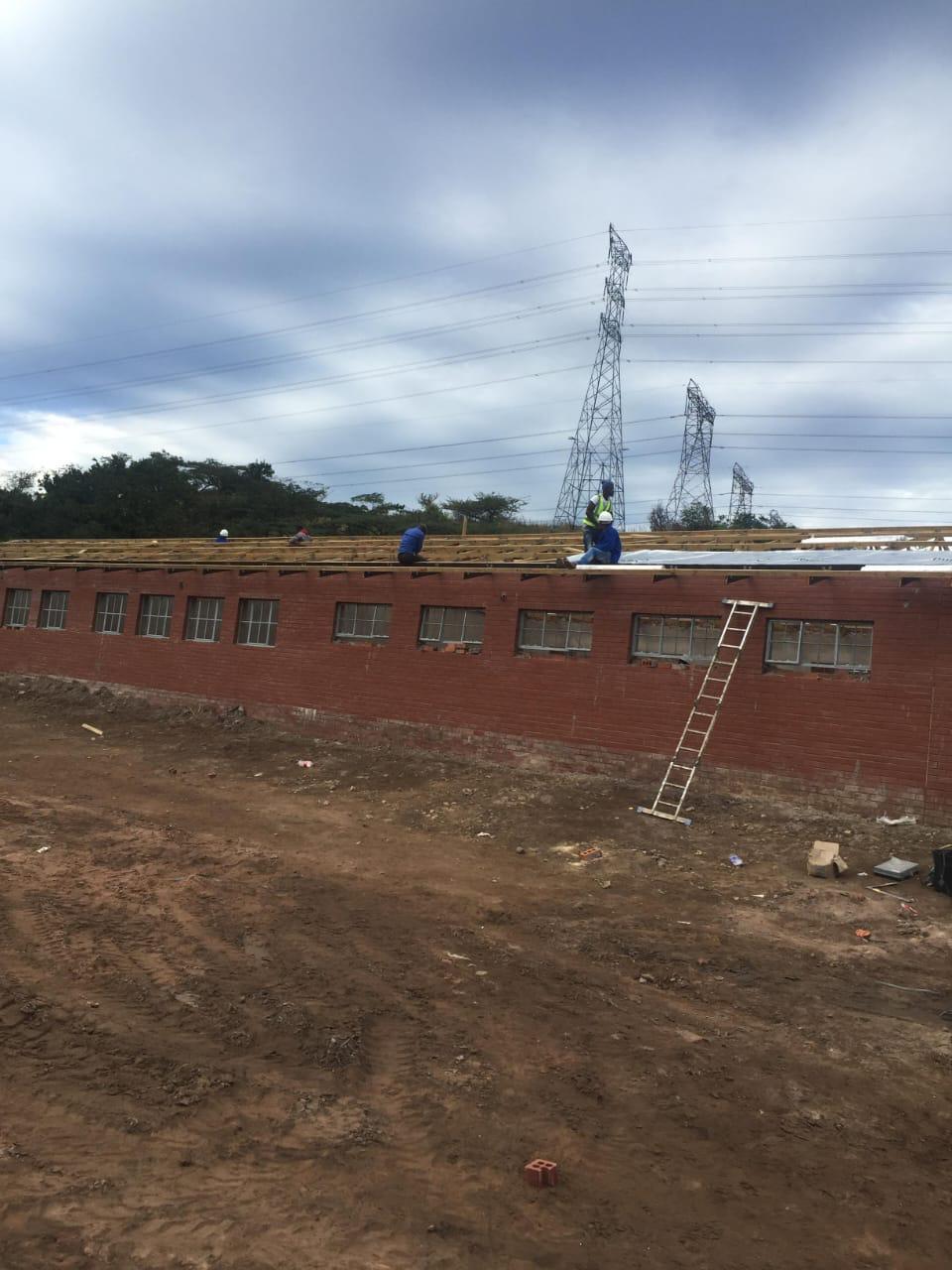 Roof truss installation on commercial building