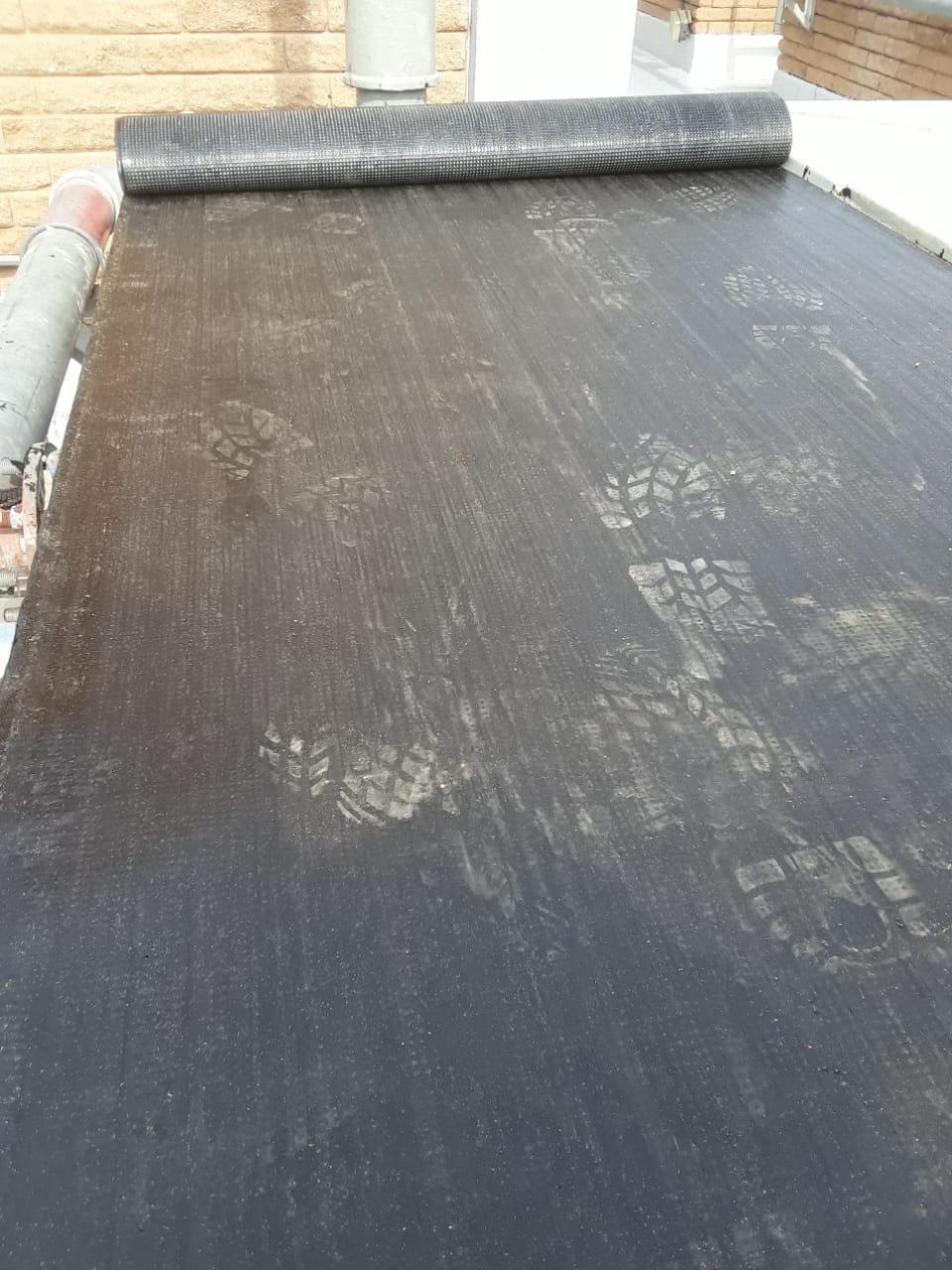Coated corrugated metal roof finished