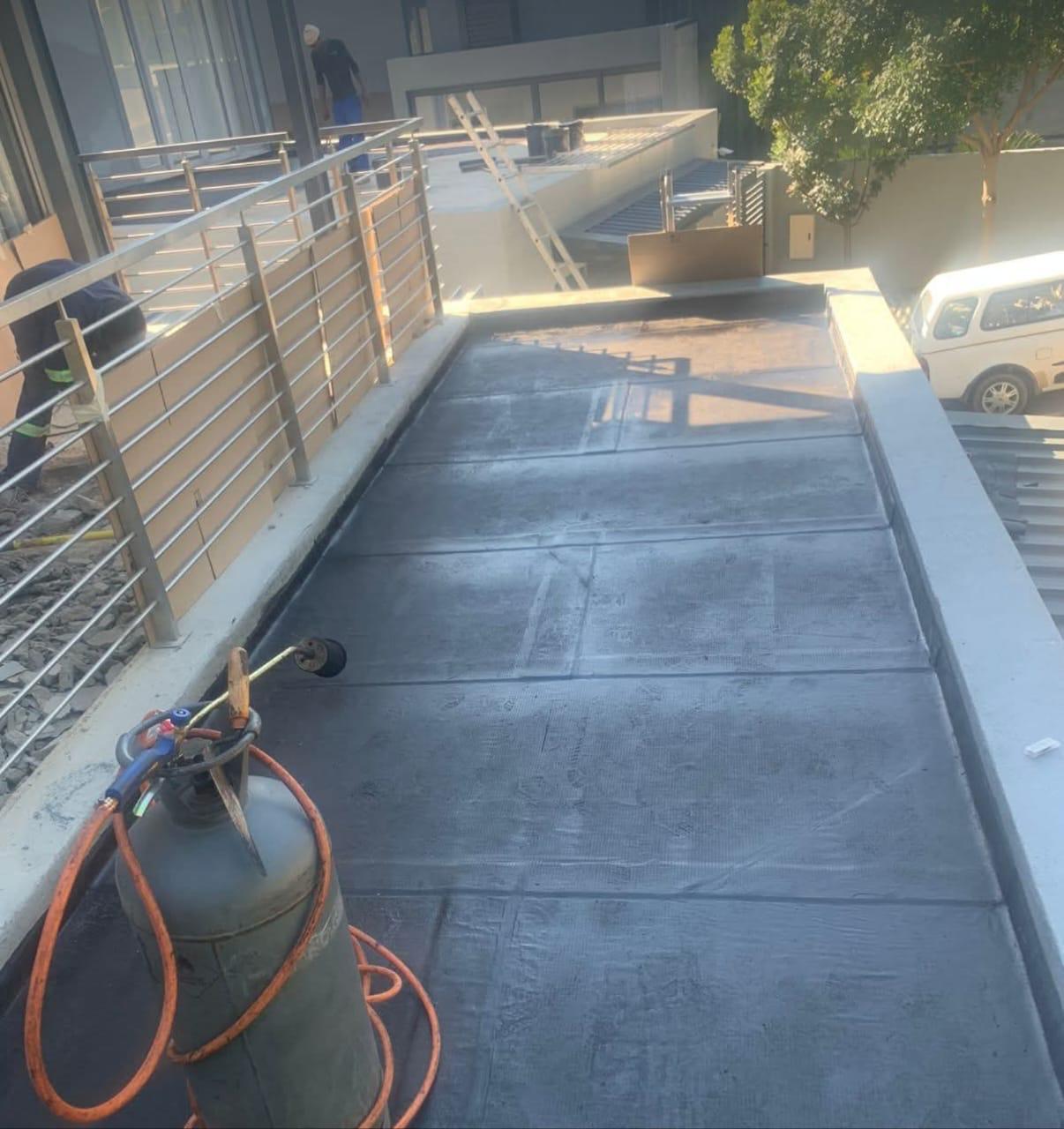 Torch-on waterproofing on residential walkway