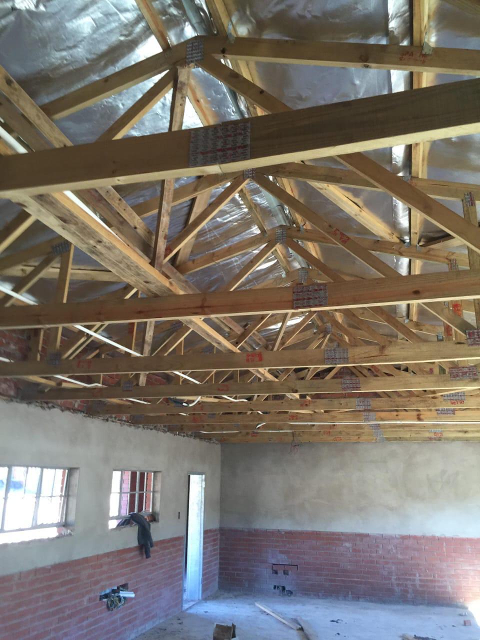 Detailed roof truss carpentry with insulation