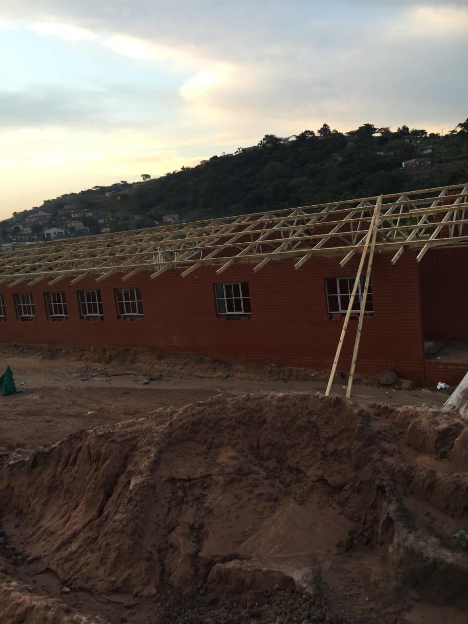 Sunset view of completed roof framing project