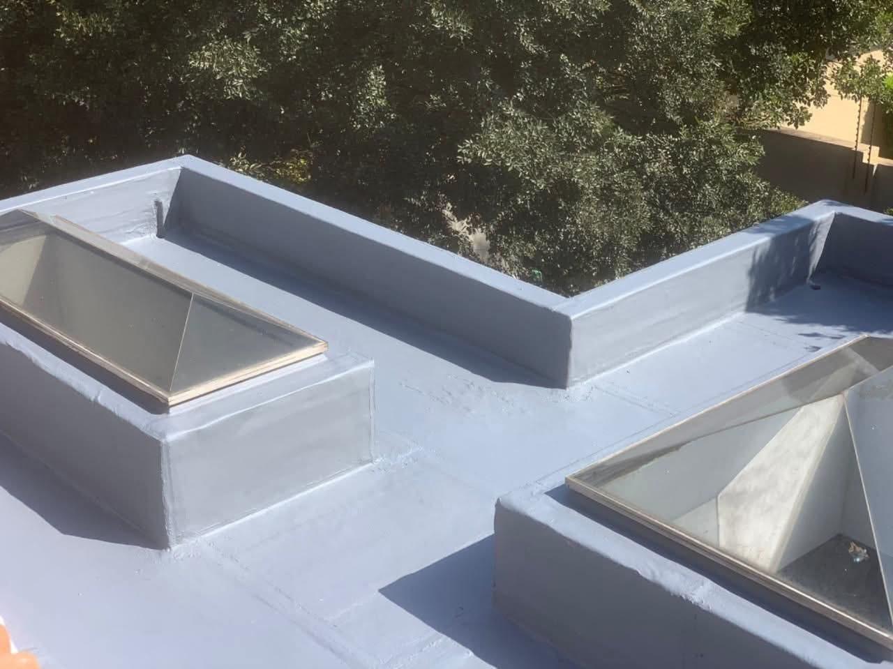 Completed flat roof waterproofing with skylights
