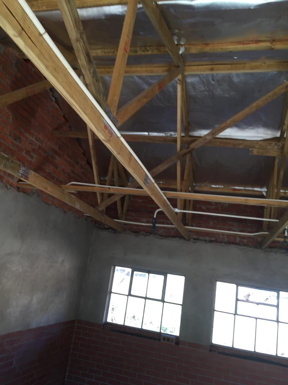 Interior view of timber roof structure with insulation
