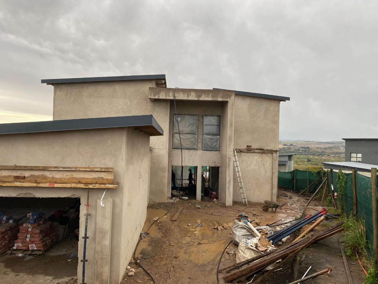 Modern double-storey home with new flat roof flashing