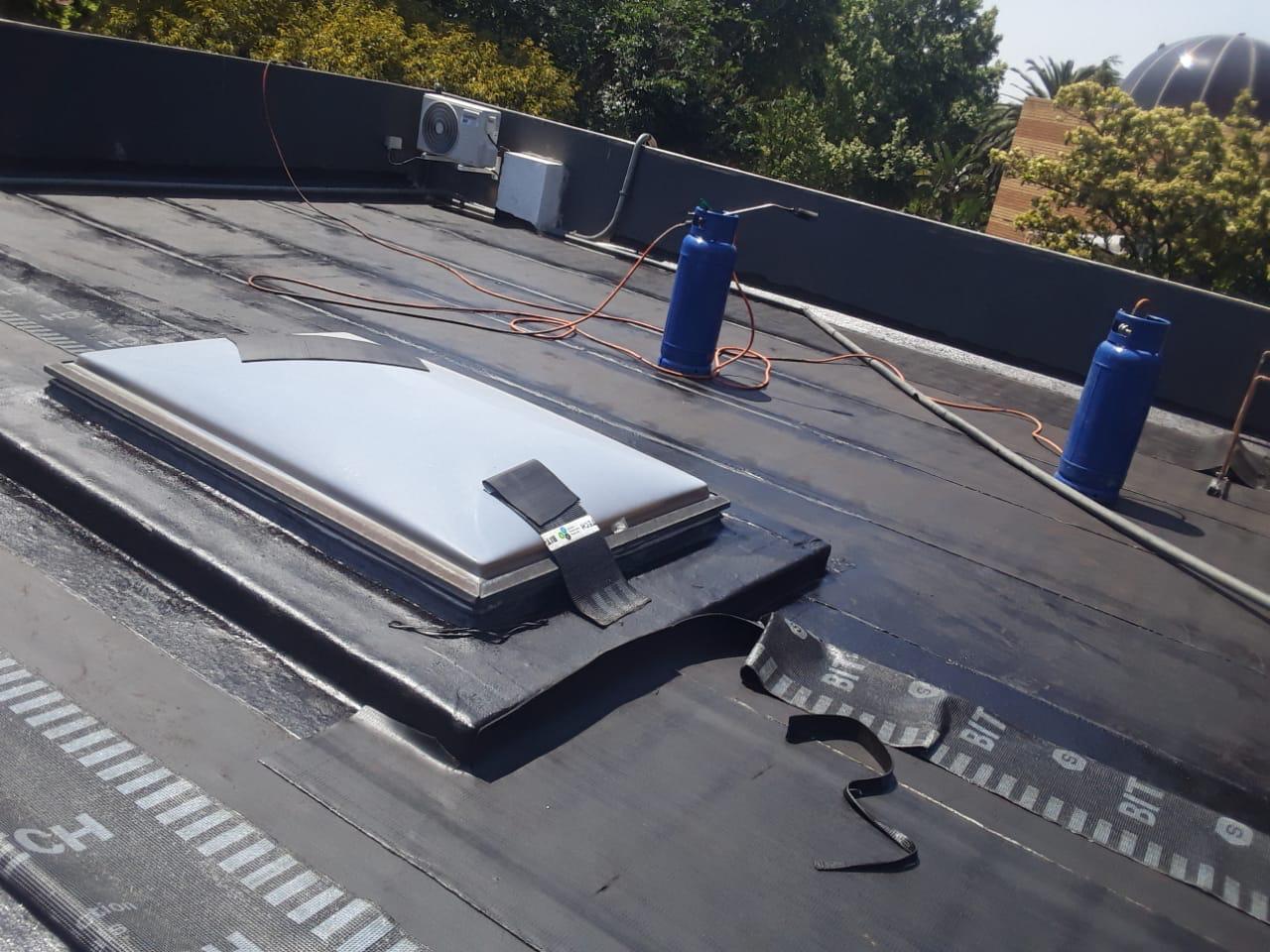 Skylight waterproofing detail on commercial flat roof