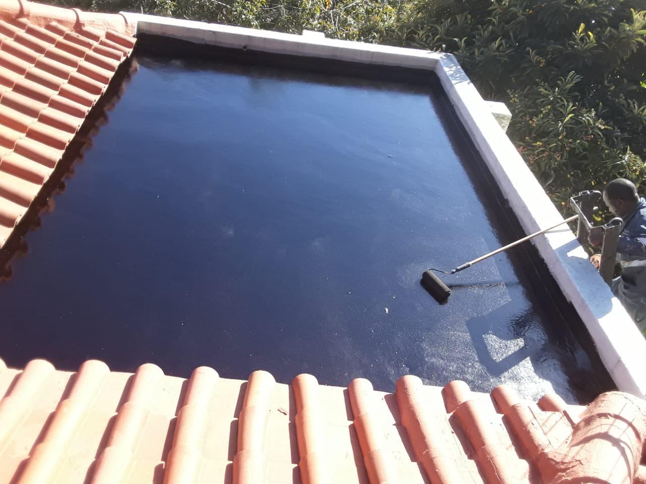 Freshly applied waterproofing coating on flat roof section
