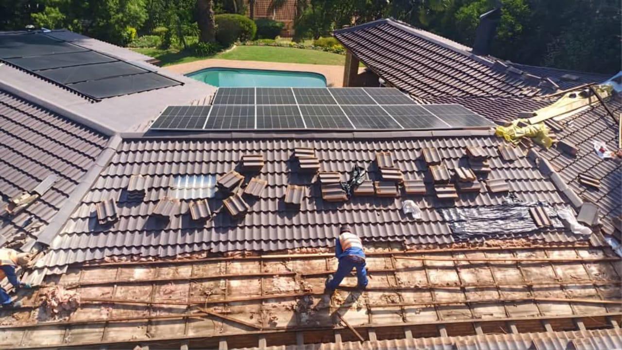 Tile roof replacement with solar panel integration