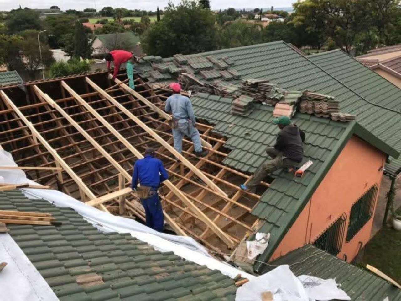 Full tile roof strip and replacement crew at work